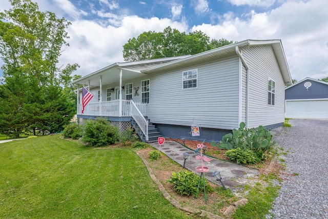 78 Gray Rd, Signal Mountain, TN 37377 - view of front facade featuring a porch, a front yard, a detached garage, stairs, and an outdoor structure