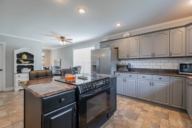 78 Gray Rd, Signal Mountain, TN 37377 - kitchen featuring appliances with stainless steel finishes, stone tile flooring, crown molding, a center island, and gray cabinets