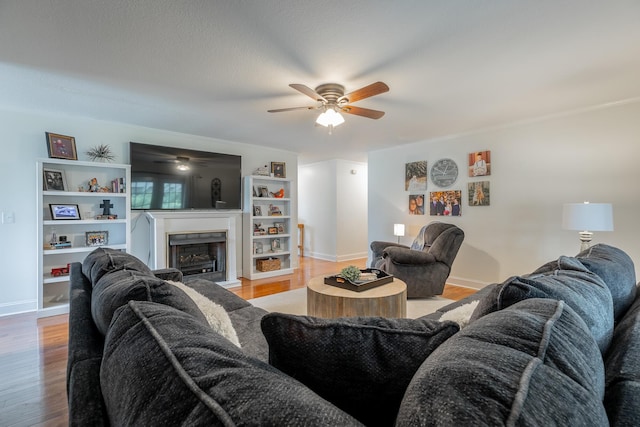 78 Gray Rd, Signal Mountain, TN 37377 - living area featuring ceiling fan, wood finished floors, and a fireplace