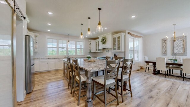 548 Buddy Rd, Burns, TN 37029 - dining room with plenty of natural light, light wood finished floors, recessed lighting, and a chandelier
