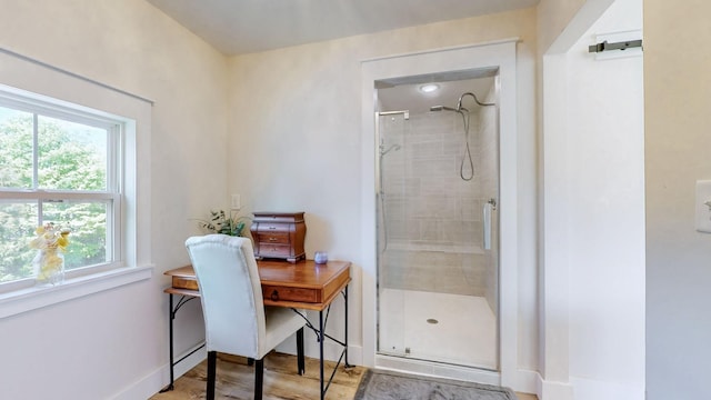 548 Buddy Rd, Burns, TN 37029 - full bathroom with a shower stall and wood finished floors