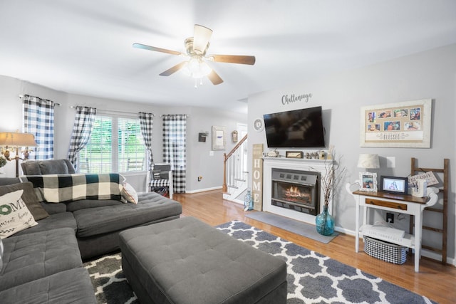 8202 Iris Rd, Chattanooga, TN 37421 - living area featuring stairs, wood finished floors, and a ceiling fan