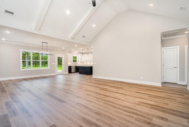 408 Harsh Ln, Castalian Springs, TN 37031 - unfurnished living room featuring recessed lighting, high vaulted ceiling, a chandelier, and light wood-style floors