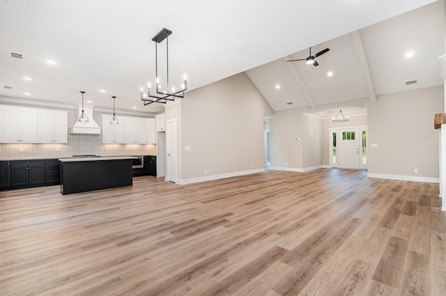 408 Harsh Ln, Castalian Springs, TN 37031 - unfurnished living room featuring a chandelier, light wood finished floors, recessed lighting, ceiling fan, and high vaulted ceiling