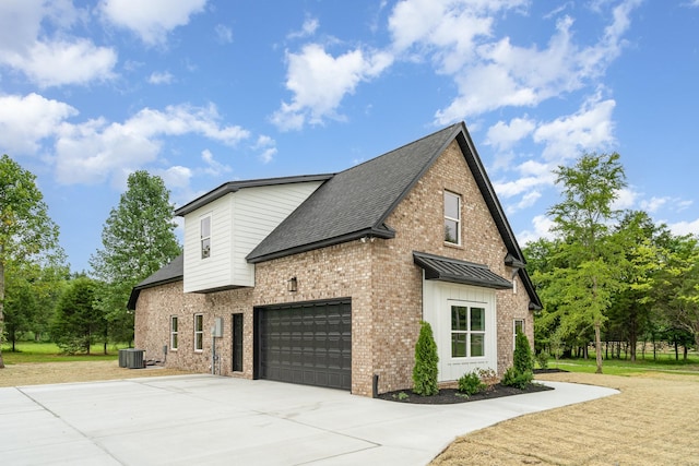 408 Harsh Ln, Castalian Springs, TN 37031 - view of side of property with concrete driveway, brick siding, a shingled roof, and a standing seam roof