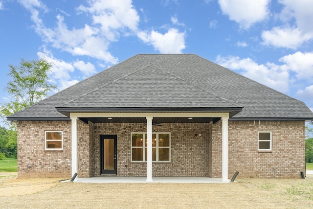 408 Harsh Ln, Castalian Springs, TN 37031 - rear view of property with roof with shingles, brick siding, and a patio