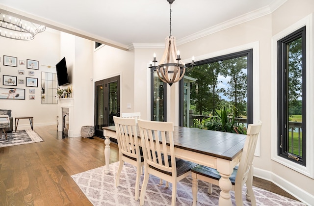 1640 Eno Rd, Dickson, TN 37055 - dining area featuring a chandelier, wood finished floors, and ornamental molding