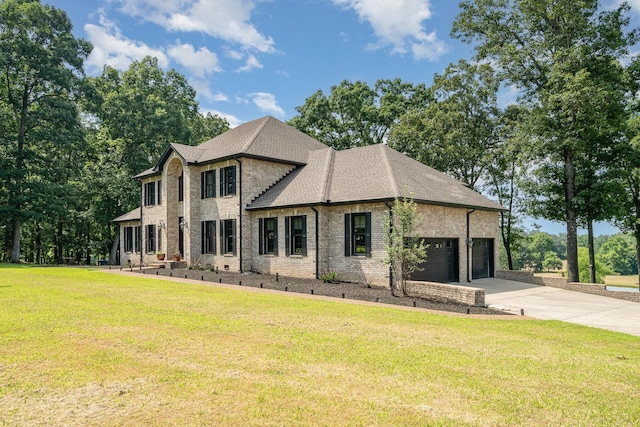 1640 Eno Rd, Dickson, TN 37055 - view of front of home with brick siding, concrete driveway, a front yard, and an attached garage