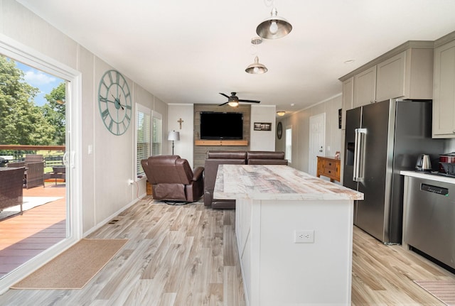 1640 Eno Rd, Dickson, TN 37055 - kitchen featuring appliances with stainless steel finishes, gray cabinetry, light wood finished floors, a center island, and ceiling fan