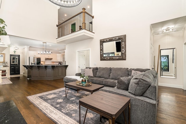 1640 Eno Rd, Dickson, TN 37055 - living room with a chandelier, dark wood-style floors, ornamental molding, and recessed lighting