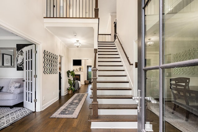 1640 Eno Rd, Dickson, TN 37055 - stairs with wood finished floors, a towering ceiling, a fireplace, ornamental molding, and french doors