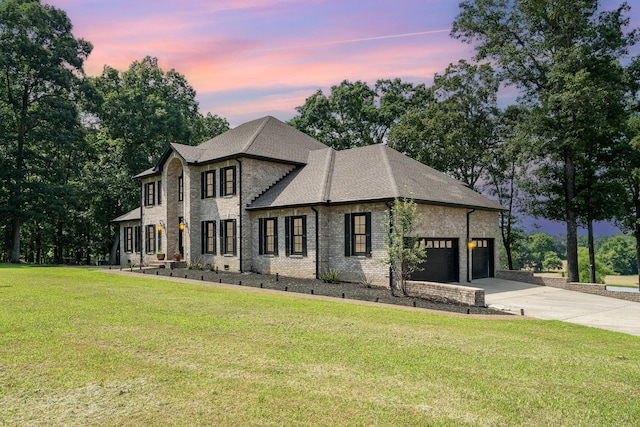 1640 Eno Rd, Dickson, TN 37055 - view of front facade with driveway, a garage, a yard, and brick siding