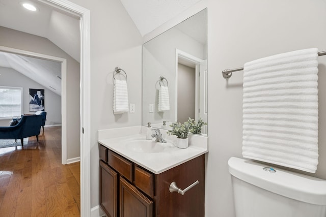 4613 Scottish Dr, Murfreesboro, TN 37128 - half bath featuring vaulted ceiling, vanity, and wood finished floors