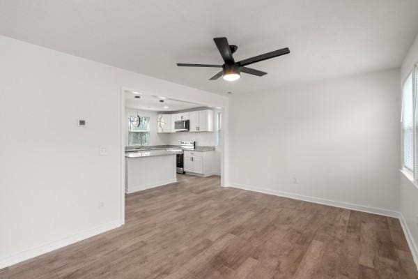 3211 Mayer Ln, Nashville, TN 37218 - unfurnished living room with a ceiling fan and light wood-style floors