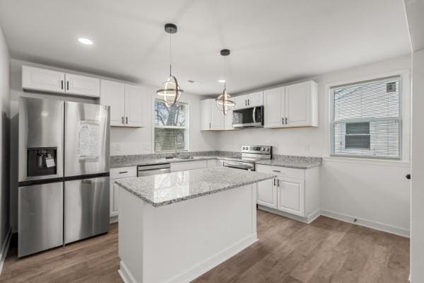 3211 Mayer Ln, Nashville, TN 37218 - kitchen featuring stainless steel appliances, dark wood-type flooring, white cabinetry, light stone counters, and recessed lighting