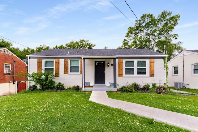 3211 Mayer Ln, Nashville, TN 37218 - view of front of house featuring a front lawn, brick siding, and cooling unit