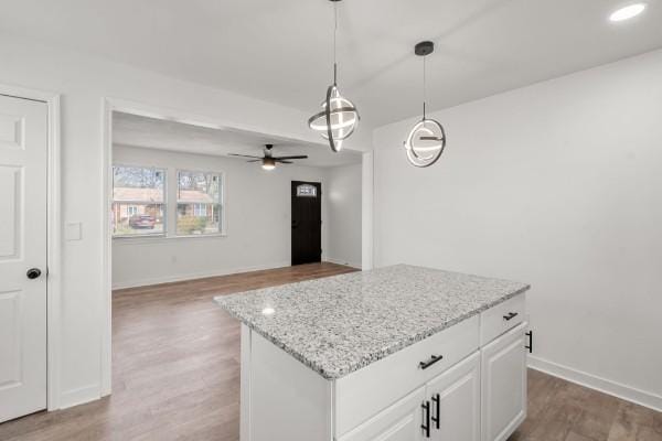 3211 Mayer Ln, Nashville, TN 37218 - kitchen with ceiling fan, hanging light fixtures, wood finished floors, and a kitchen island