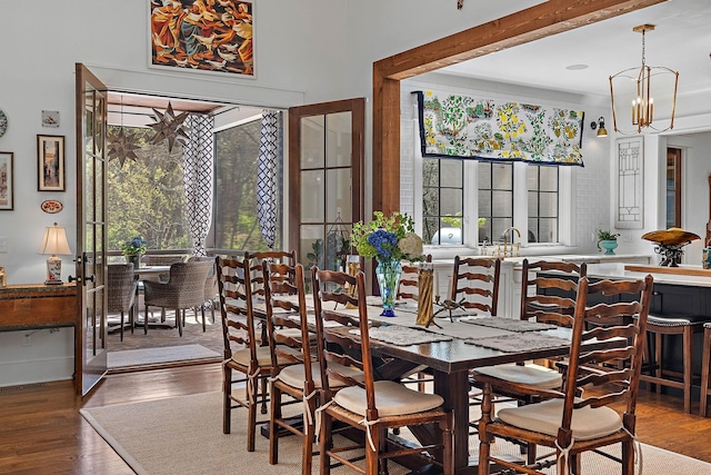 1049 Holly Tree Gap Rd, Brentwood, TN 37027 - dining room with wood finished floors and a chandelier