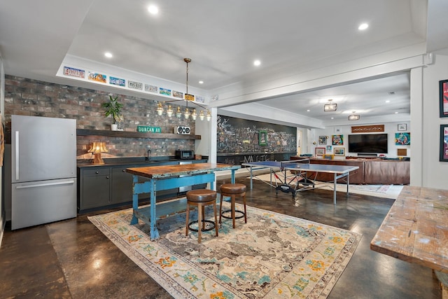 1049 Holly Tree Gap Rd, Brentwood, TN 37027 - indoor bar with freestanding refrigerator, finished concrete flooring, backsplash, and recessed lighting