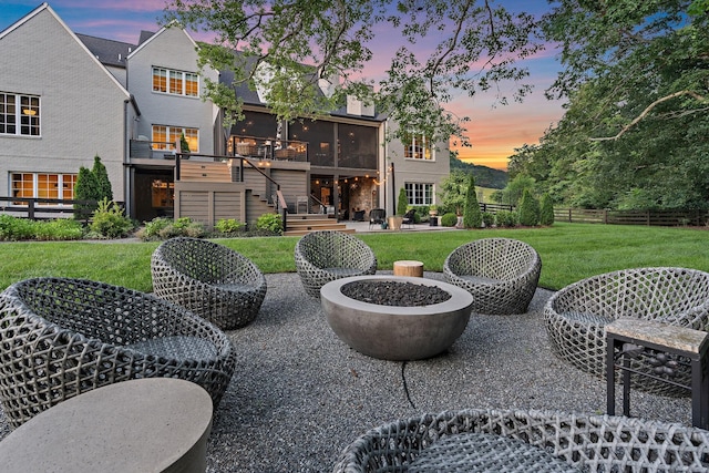 1049 Holly Tree Gap Rd, Brentwood, TN 37027 - view of patio featuring stairway, a fire pit, and a sunroom