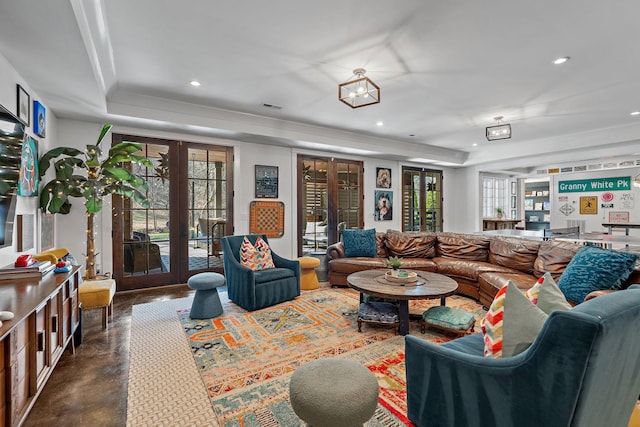 1049 Holly Tree Gap Rd, Brentwood, TN 37027 - living room featuring french doors, a tray ceiling, healthy amount of natural light, finished concrete floors, and recessed lighting