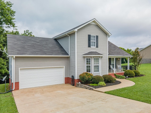 216 Desperado Ave, Pulaski, TN 38478 - traditional home with a porch, a front lawn, roof with shingles, concrete driveway, and a garage