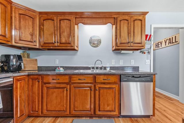 216 Desperado Ave, Pulaski, TN 38478 - kitchen with appliances with stainless steel finishes, light wood finished floors, and brown cabinetry