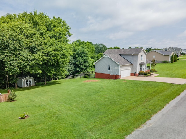 216 Desperado Ave, Pulaski, TN 38478 - view of home's exterior with driveway, brick siding, a shed, a garage, and roof with shingles