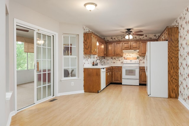 140 Janes Way NE, Cleveland, TN 37323 - kitchen featuring white appliances, brown cabinets, ceiling fan, under cabinet range hood, and light wood finished floors