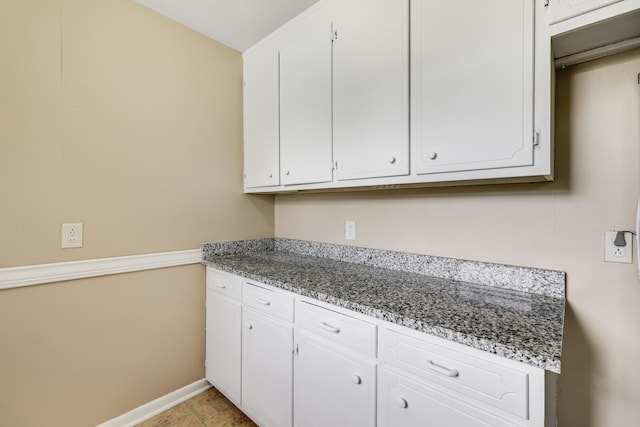 201 Sterry Ct, Antioch, TN 37013 - kitchen featuring white cabinetry, light stone countertops, and light tile patterned floors