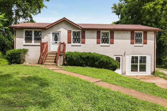 201 Sterry Ct, Antioch, TN 37013 - view of front of property with a front lawn, a metal roof, and brick siding
