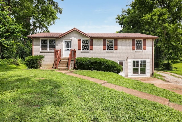 201 Sterry Ct, Antioch, TN 37013 - view of front of property featuring a front lawn, brick siding, and a metal roof