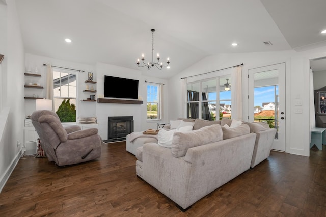 5726 Bridgemore Blvd, Murfreesboro, TN 37129 - living room featuring plenty of natural light, dark wood finished floors, a glass covered fireplace, a chandelier, and vaulted ceiling