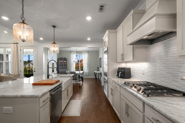 5726 Bridgemore Blvd, Murfreesboro, TN 37129 - kitchen with custom range hood, appliances with stainless steel finishes, a chandelier, backsplash, and recessed lighting
