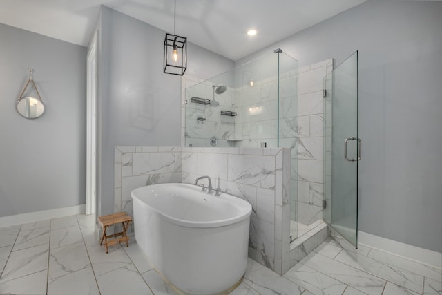 5726 Bridgemore Blvd, Murfreesboro, TN 37129 - bathroom with marble look tiles, a shower stall, a freestanding tub, and recessed lighting