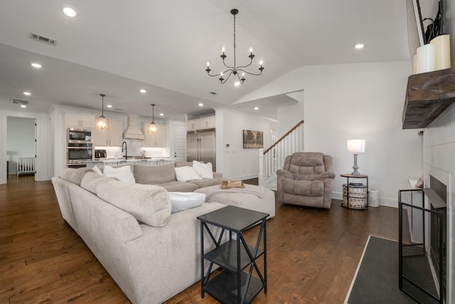 5726 Bridgemore Blvd, Murfreesboro, TN 37129 - living room featuring lofted ceiling, stairs, recessed lighting, a fireplace, and dark wood-style floors