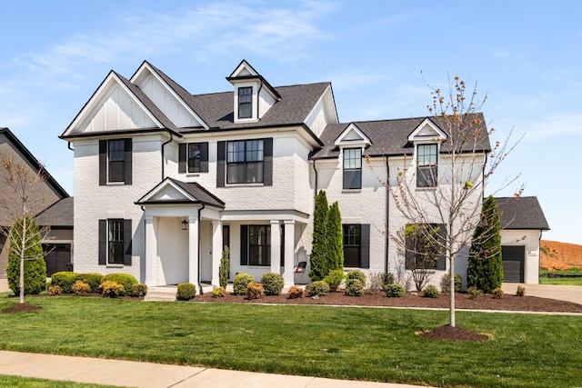 5726 Bridgemore Blvd, Murfreesboro, TN 37129 - view of front facade with a front lawn, brick siding, driveway, and board and batten siding