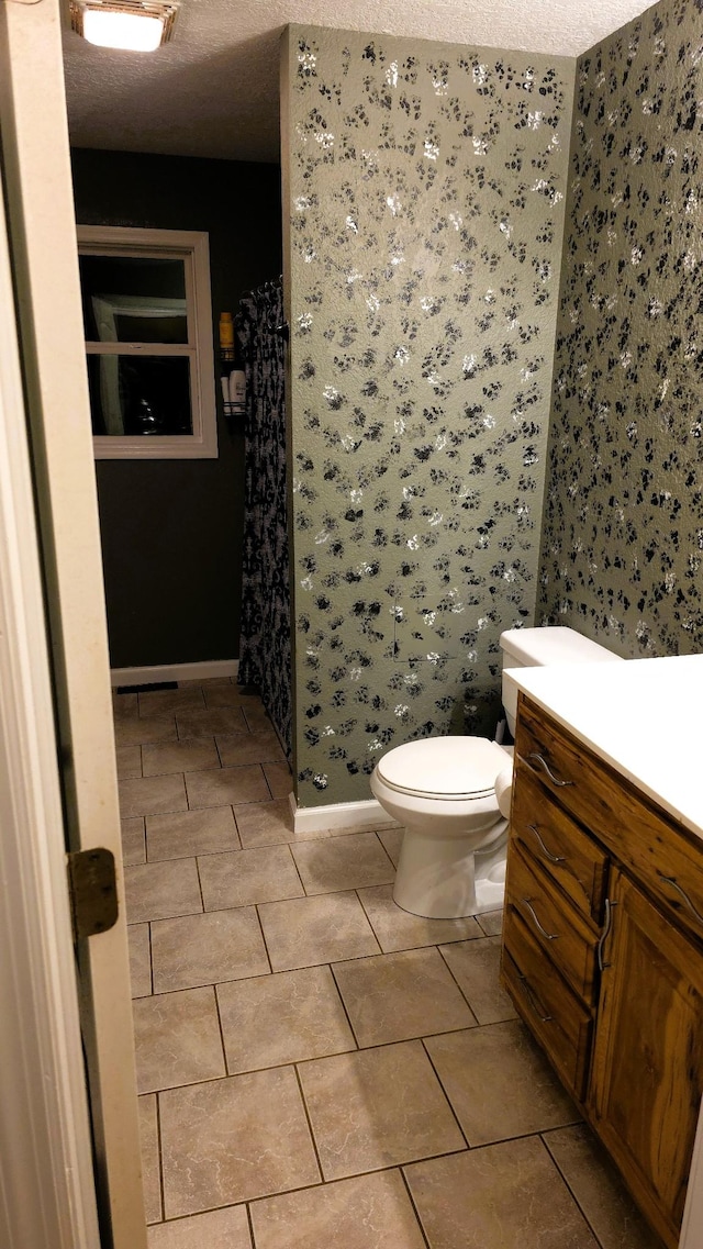 145 Michelle Ln, Winchester, TN 37398 - full bathroom with a stall shower, vanity, tile patterned flooring, and a textured ceiling