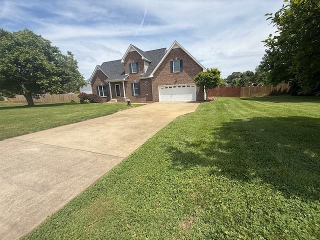 2750 Shepherds Ct, Woodlawn, TN 37191 - traditional-style home with driveway, brick siding, and a garage