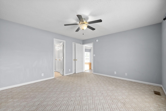 2750 Shepherds Ct, Woodlawn, TN 37191 - unfurnished bedroom featuring light colored carpet, ensuite bath, ceiling fan, and a textured ceiling