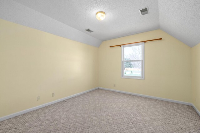 2750 Shepherds Ct, Woodlawn, TN 37191 - bonus room with lofted ceiling, carpet flooring, and a textured ceiling