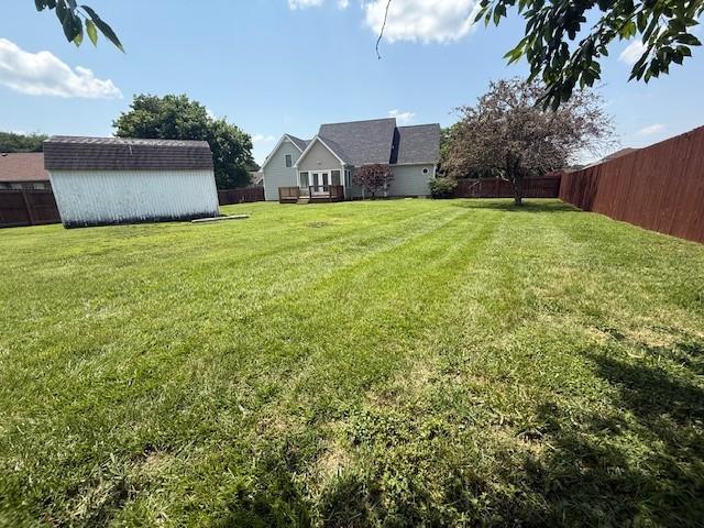 2750 Shepherds Ct, Woodlawn, TN 37191 - fenced backyard featuring a storage shed