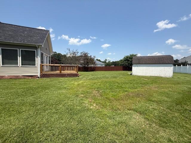 2750 Shepherds Ct, Woodlawn, TN 37191 - view of yard with a storage unit and a wooden deck