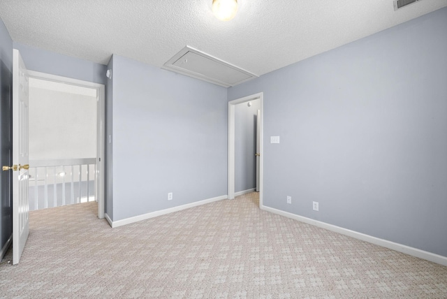 2750 Shepherds Ct, Woodlawn, TN 37191 - carpeted empty room featuring attic access and a textured ceiling