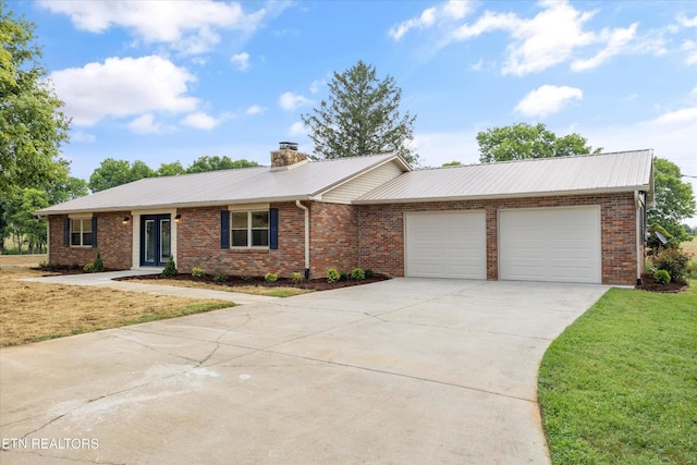 1701 Talbott Kansas Rd, Talbott, TN 37877 - ranch-style house featuring concrete driveway, a garage, brick siding, a metal roof, and a front yard
