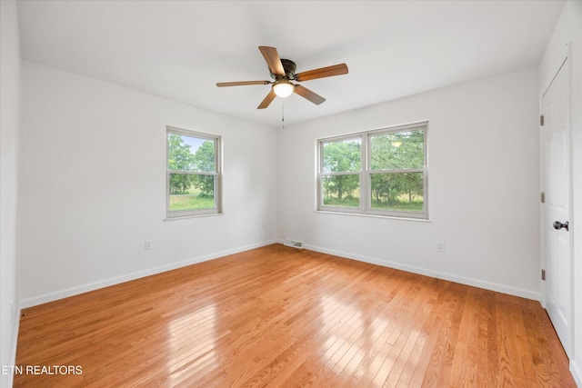 1701 Talbott Kansas Rd, Talbott, TN 37877 - unfurnished room featuring healthy amount of natural light, light wood finished floors, and a ceiling fan