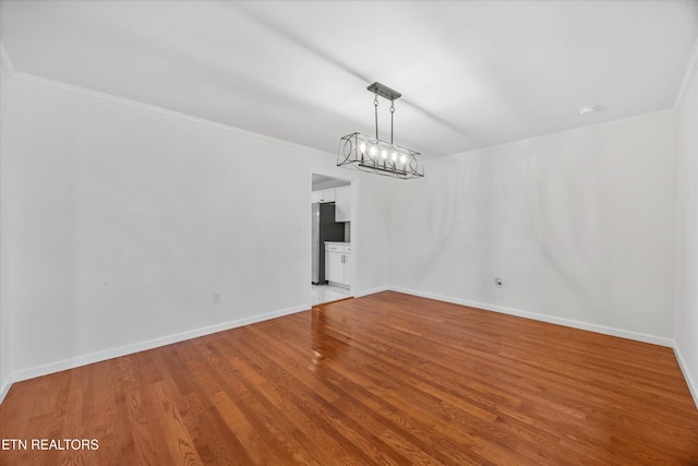 1701 Talbott Kansas Rd, Talbott, TN 37877 - unfurnished dining area featuring wood finished floors, ornamental molding, and a chandelier