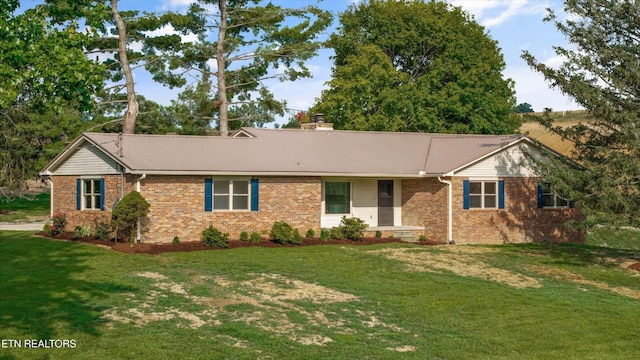 1701 Talbott Kansas Rd, Talbott, TN 37877 - ranch-style home with brick siding, a front yard, a chimney, and a metal roof