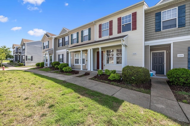 5428 Cedar Ash Xing, Antioch, TN 37013 - townhome / multi-family property with a residential view, a front yard, and covered porch