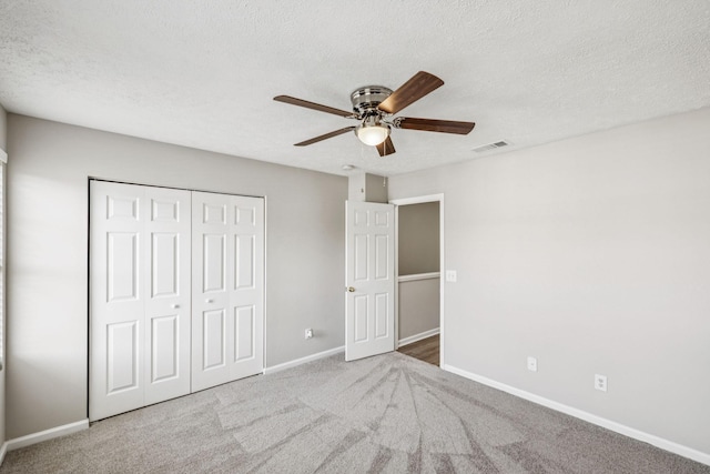 5428 Cedar Ash Xing, Antioch, TN 37013 - unfurnished bedroom featuring a closet, carpet, a textured ceiling, and a ceiling fan